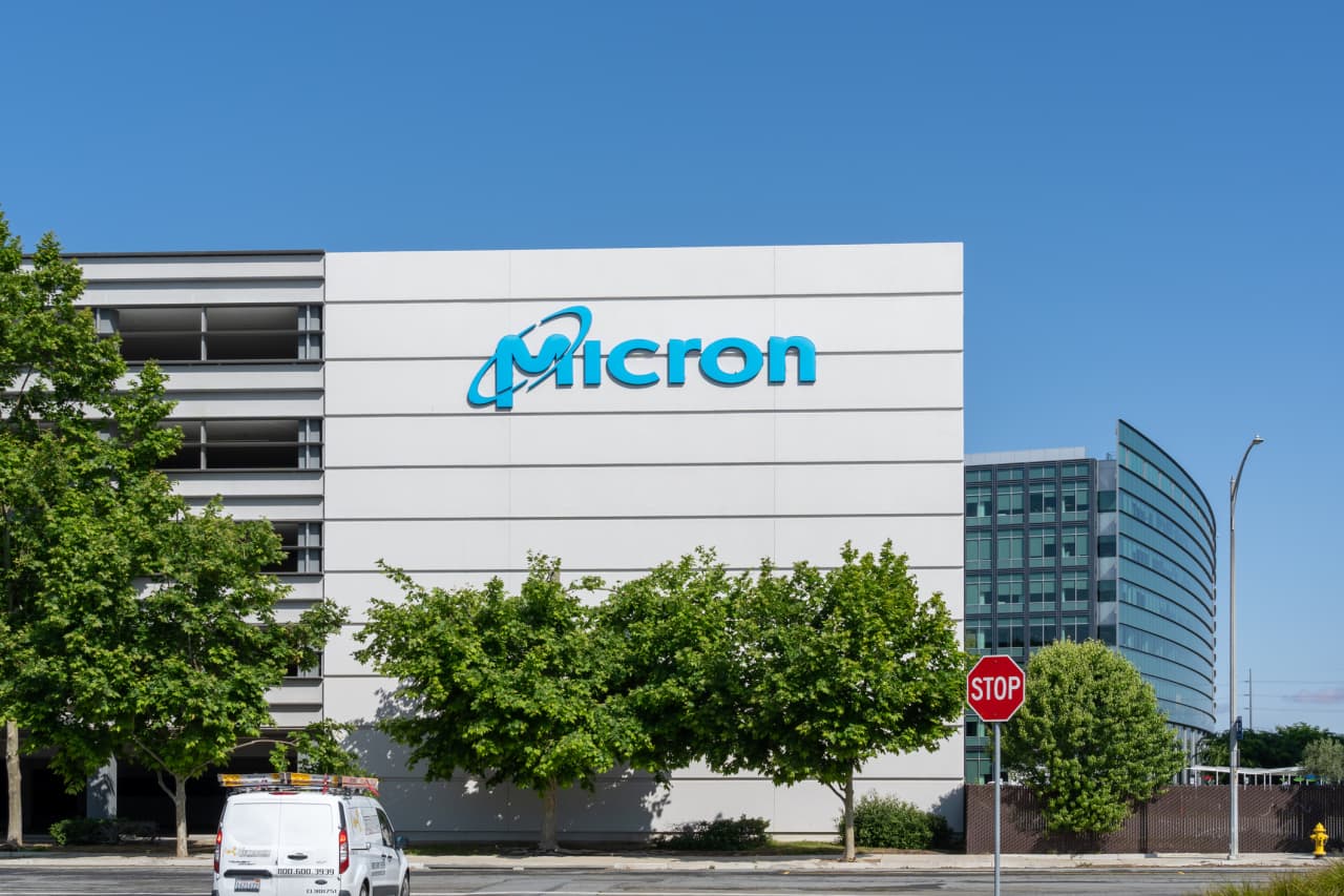 Micron Technology stock chart showing an upward trend with a backdrop of circuit boards, symbolizing market recovery in the semiconductor industry.